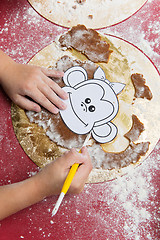Image showing Child making christmas gingerbread