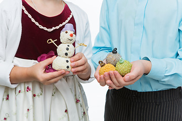 Image showing Children holding christmas dessert