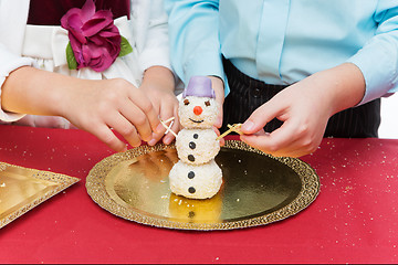 Image showing Children making christmas dessert