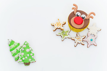 Image showing New Year cupcake and cookies