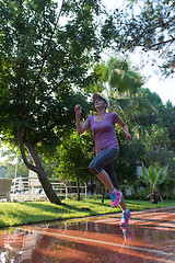 Image showing sporty woman jogging