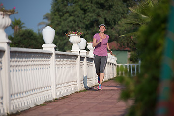 Image showing sporty woman jogging