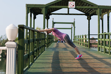 Image showing woman  stretching before morning jogging