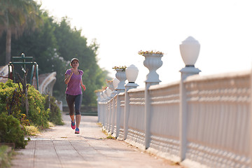 Image showing sporty woman jogging