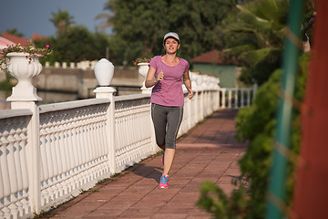 Image showing sporty woman jogging