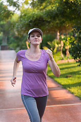 Image showing sporty woman jogging