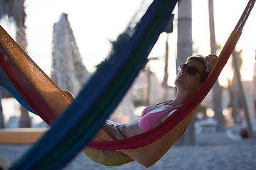 Image showing relaxed woman laying in hammock