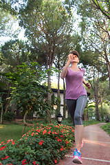 Image showing sporty woman jogging