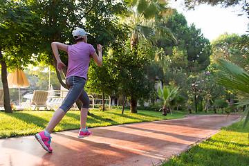 Image showing sporty woman jogging