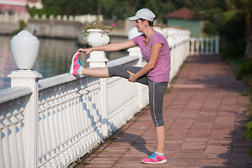 Image showing woman  stretching before morning jogging