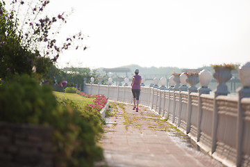 Image showing sporty woman jogging