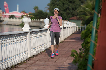 Image showing sporty woman jogging