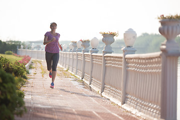 Image showing sporty woman jogging