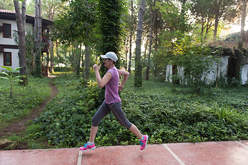 Image showing sporty woman jogging