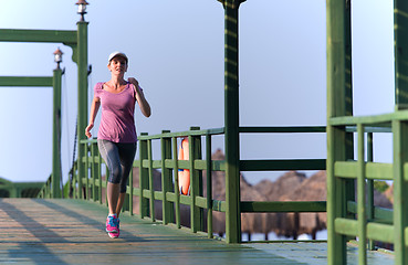 Image showing sporty woman jogging