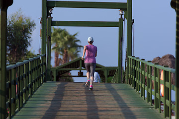 Image showing sporty woman jogging