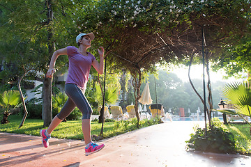 Image showing sporty woman jogging