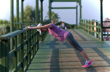 Image showing woman  stretching before morning jogging