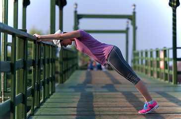 Image showing woman  stretching before morning jogging