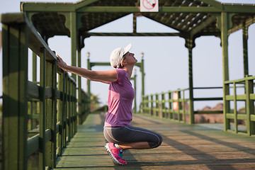 Image showing woman  stretching before morning jogging