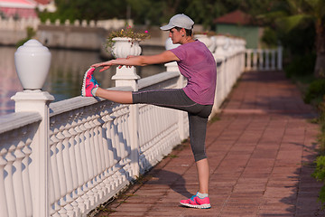 Image showing woman  stretching before morning jogging