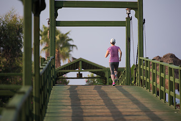 Image showing sporty woman jogging