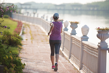 Image showing sporty woman jogging