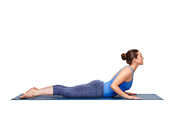 Image showing Sporty fit yogini woman practices yoga asana bhujangasana 