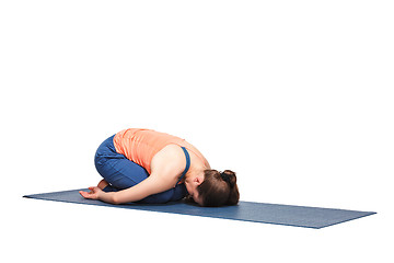 Image showing Beautiful sporty fit yogi girl practices yoga asana balasana\r