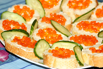 Image showing sandwiches with red caviar and cucumber 