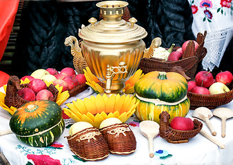 Image showing On the table for tea is a beautiful samovar .