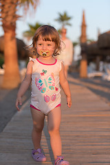 Image showing girl and mother walking