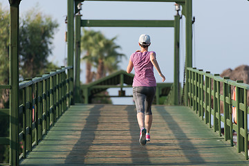 Image showing sporty woman jogging