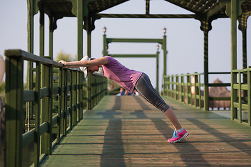 Image showing woman  stretching before morning jogging