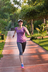 Image showing sporty woman jogging