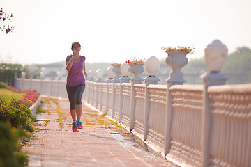 Image showing sporty woman jogging