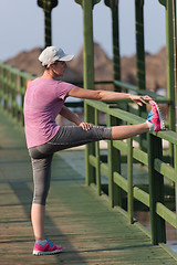 Image showing woman  stretching before morning jogging