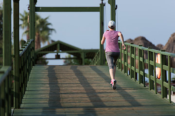 Image showing sporty woman jogging