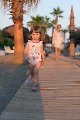 Image showing girl and mother walking