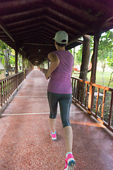 Image showing sporty woman jogging