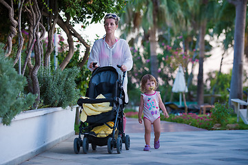 Image showing girl and mother walking