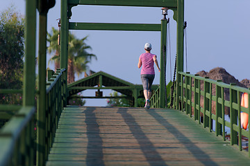 Image showing sporty woman jogging