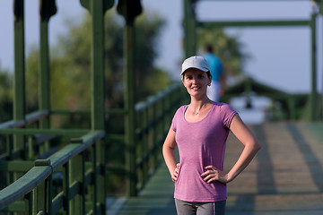 Image showing woman  stretching before morning jogging