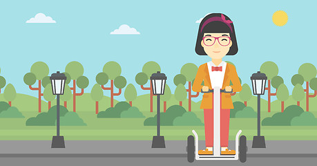 Image showing Woman driving electric scooter.