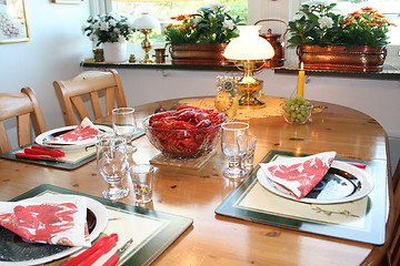 Image showing Laid table with crayfish