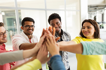 Image showing group of international students making high five