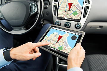 Image showing close up of man with tablet pc in car