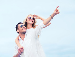 Image showing couple in shades at sea side