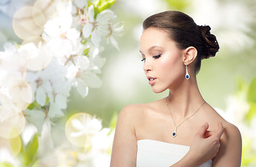 Image showing beautiful asian woman with earring and pendant