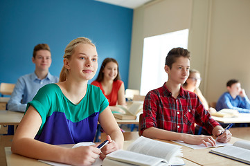 Image showing group of students with books at school lesson